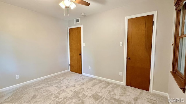 504 N Moore St, Waterloo, IL 62298 - unfurnished bedroom featuring carpet floors and ceiling fan