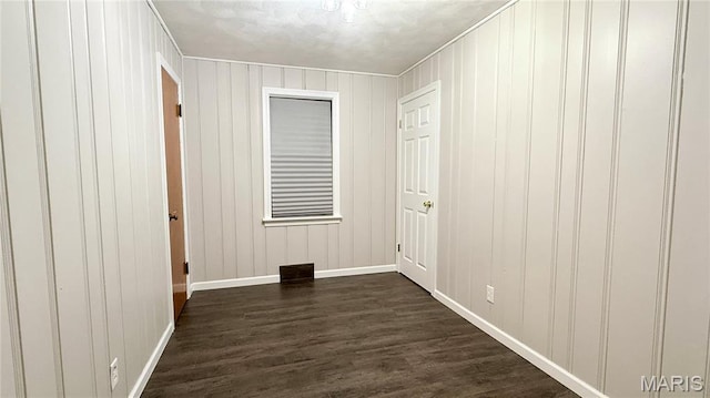 504 N Moore St, Waterloo, IL 62298 - empty room featuring dark wood finished floors and baseboards