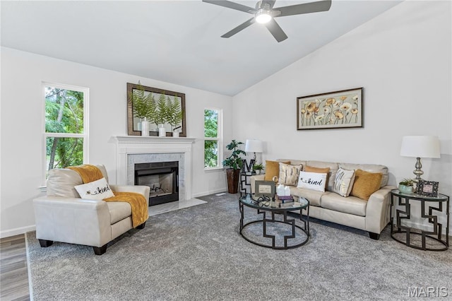 1941 Magnolia Way, Pevely, MO 63070 - living area with a premium fireplace, a ceiling fan, vaulted ceiling, and wood finished floors