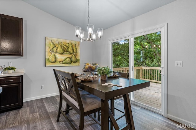 1941 Magnolia Way, Pevely, MO 63070 - dining room with a chandelier, dark wood-style floors, and lofted ceiling