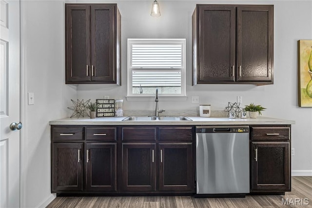 1941 Magnolia Way, Pevely, MO 63070 - kitchen with dishwasher, dark brown cabinets, light countertops, and wood finished floors
