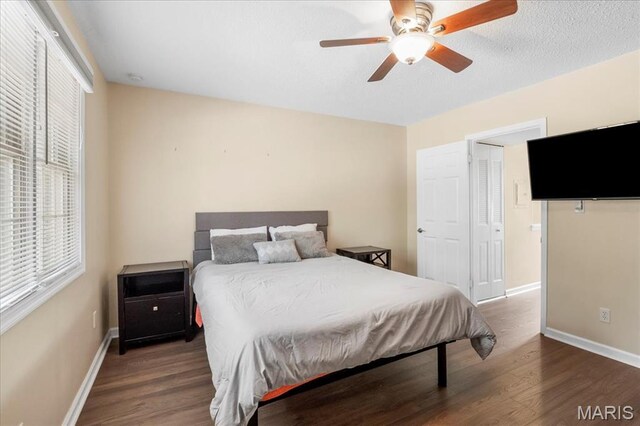 9053 W Swan Cir, Brentwood, MO 63144 - bedroom with wood finished floors and ceiling fan
