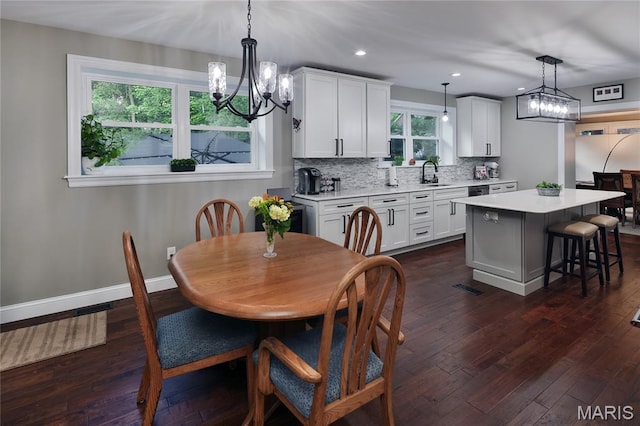 728 Yale Ave, Saint Louis, MO 63130 - dining area with a chandelier, dark wood-style flooring, and recessed lighting
