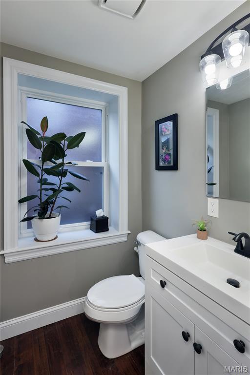 728 Yale Ave, Saint Louis, MO 63130 - half bath with vanity and wood finished floors