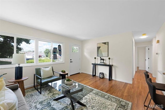 7944 Lavington Dr, Richmond Heights, MO 63117 - living area featuring wood finished floors and baseboards