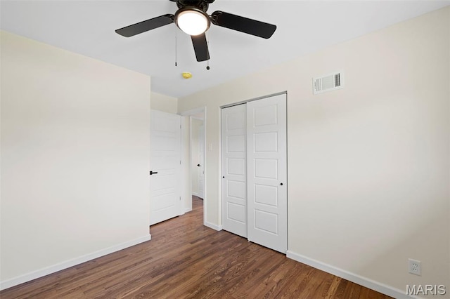 7944 Lavington Dr, Richmond Heights, MO 63117 - unfurnished bedroom with wood finished floors, a closet, and a ceiling fan