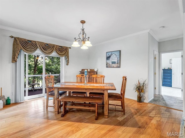 394 Sunset Echo Rd, Union, MO 63084 - dining room featuring a chandelier, light wood finished floors, and ornamental molding