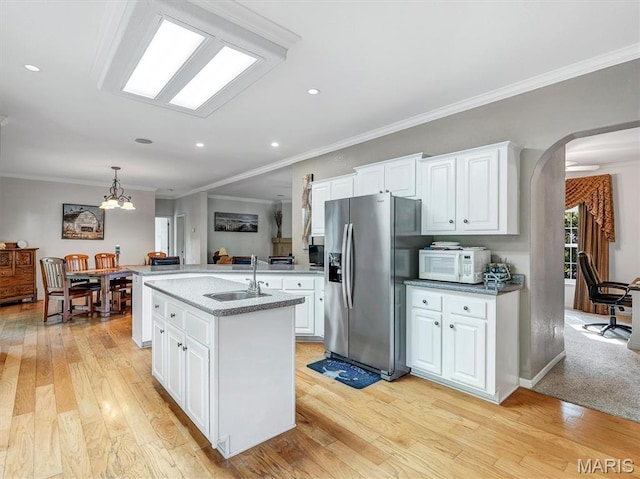 394 Sunset Echo Rd, Union, MO 63084 - kitchen featuring stainless steel fridge with ice dispenser, arched walkways, white microwave, light wood finished floors, and ornamental molding
