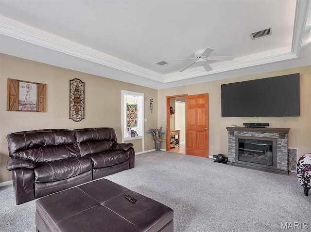 394 Sunset Echo Rd, Union, MO 63084 - carpeted living room with a tray ceiling, ceiling fan, a fireplace, and crown molding