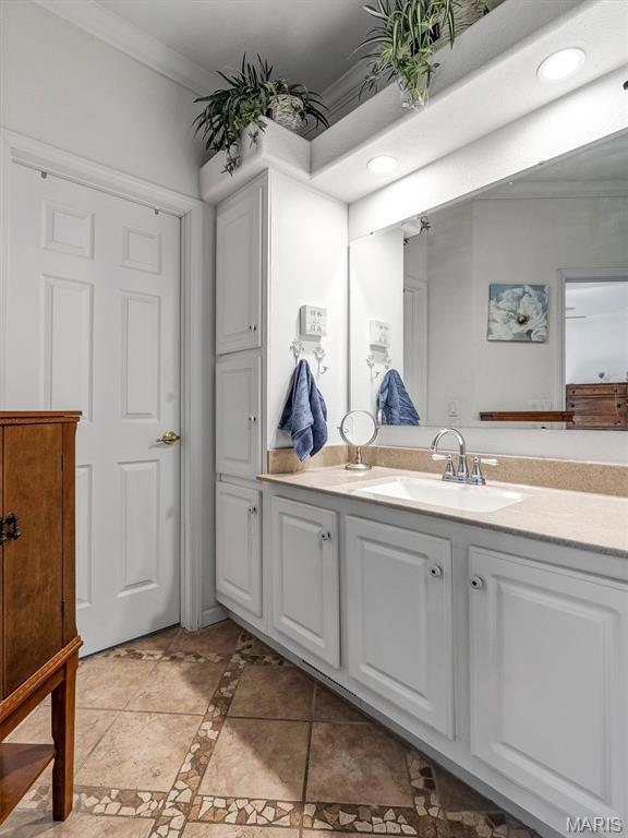 394 Sunset Echo Rd, Union, MO 63084 - bathroom featuring ornamental molding, vanity, recessed lighting, inlaid floor details, and tile patterned floors