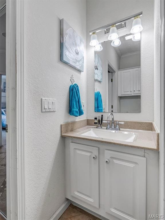 394 Sunset Echo Rd, Union, MO 63084 - bathroom with vanity, a textured wall, tile patterned flooring, and ornamental molding