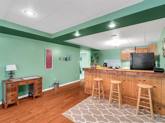 394 Sunset Echo Rd, Union, MO 63084 - indoor bar featuring freestanding refrigerator, light wood-style flooring, a paneled ceiling, and recessed lighting