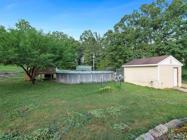 394 Sunset Echo Rd, Union, MO 63084 - view of green lawn with a storage shed and an outdoor pool