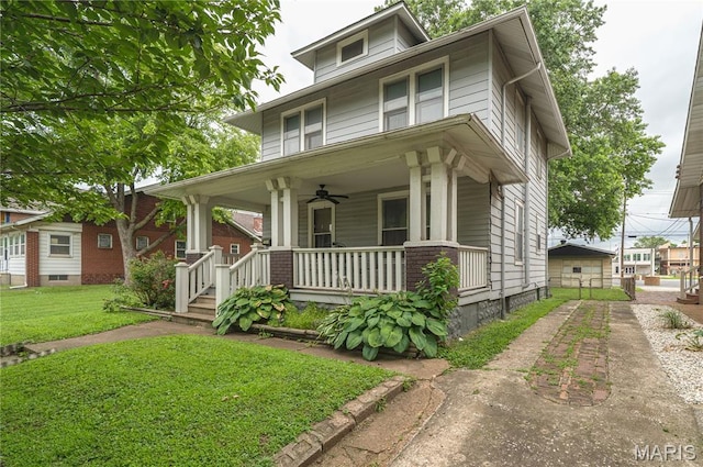 2324 Grand Ave, Granite City, IL 62040 - traditional style home featuring covered porch, a ceiling fan, a front lawn, and driveway