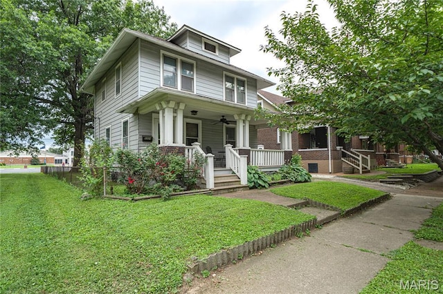 2324 Grand Ave, Granite City, IL 62040 - traditional style home with covered porch, a front yard, and ceiling fan