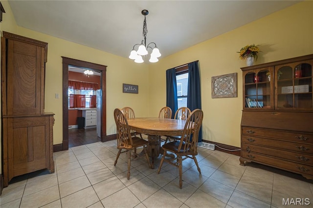 2324 Grand Ave, Granite City, IL 62040 - dining space with a chandelier and light tile patterned floors