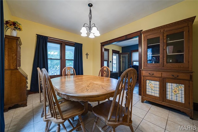 2324 Grand Ave, Granite City, IL 62040 - dining area featuring a chandelier and light tile patterned floors