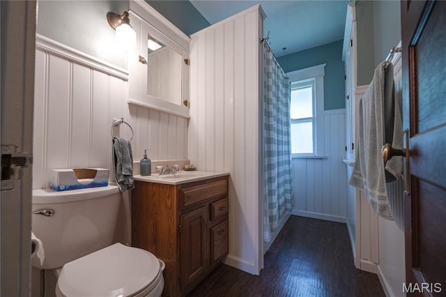 2324 Grand Ave, Granite City, IL 62040 - bathroom with a decorative wall, vanity, wood finished floors, wainscoting, and curtained shower