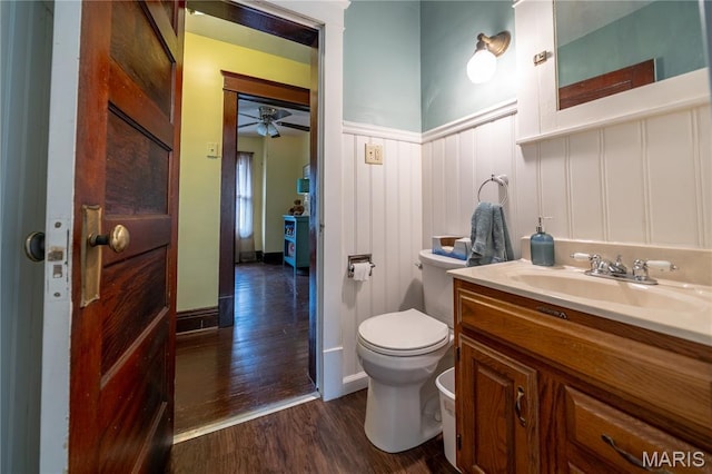 2324 Grand Ave, Granite City, IL 62040 - bathroom with wood finished floors, vanity, wainscoting, ceiling fan, and a decorative wall