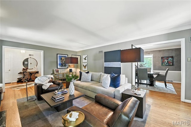 43 Highgate Rd, Olivette, MO 63132 - living room with light wood finished floors and crown molding