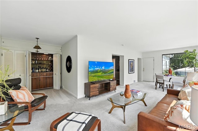 43 Highgate Rd, Olivette, MO 63132 - living room with light colored carpet and a bar