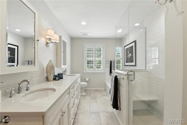 43 Highgate Rd, Olivette, MO 63132 - full bathroom with double vanity, tiled shower, marble finish flooring, and recessed lighting