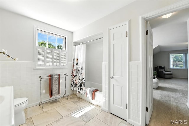 43 Highgate Rd, Olivette, MO 63132 - full bath featuring tile walls, shower / tub combo, and a wainscoted wall