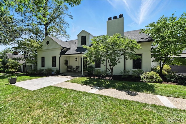 43 Highgate Rd, Olivette, MO 63132 - back of property featuring a yard, a patio, and a chimney