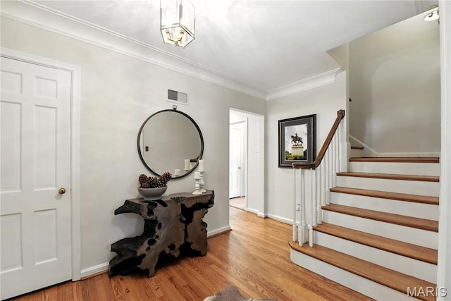 43 Highgate Rd, Olivette, MO 63132 - foyer featuring stairway, wood finished floors, and crown molding