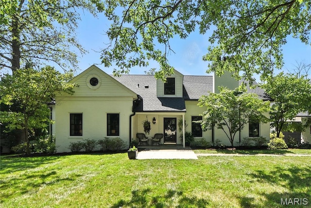 43 Highgate Rd, Olivette, MO 63132 - back of house with a lawn, a patio, and roof with shingles