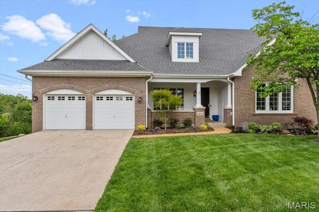 1931 Chesterfield Ridge Cir, Chesterfield, MO 63017 - view of front facade with an attached garage, covered porch, a front lawn, concrete driveway, and a shingled roof