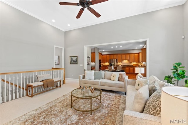1931 Chesterfield Ridge Cir, Chesterfield, MO 63017 - living room with ceiling fan, a high ceiling, recessed lighting, ornamental molding, and light carpet