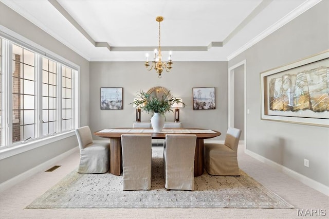 1931 Chesterfield Ridge Cir, Chesterfield, MO 63017 - carpeted dining space with a chandelier, a raised ceiling, and crown molding