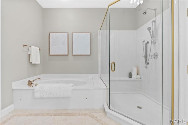 1931 Chesterfield Ridge Cir, Chesterfield, MO 63017 - bathroom with a garden tub, a shower stall, and inlaid floor details