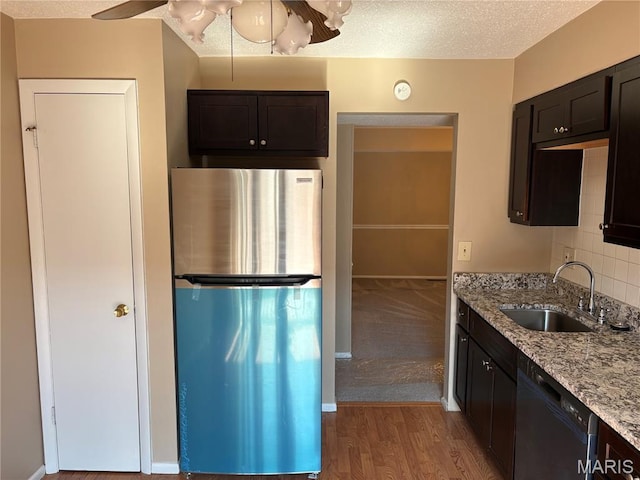 10335 Forest Brook Ln Unit C, Creve Coeur, MO 63146 - kitchen with freestanding refrigerator, dishwasher, light stone countertops, wood finished floors, and tasteful backsplash