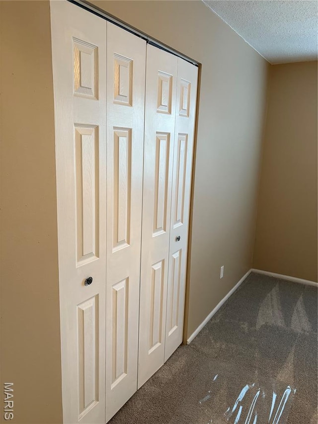 10335 Forest Brook Ln Unit C, Creve Coeur, MO 63146 - unfurnished bedroom featuring carpet, a closet, and a textured ceiling