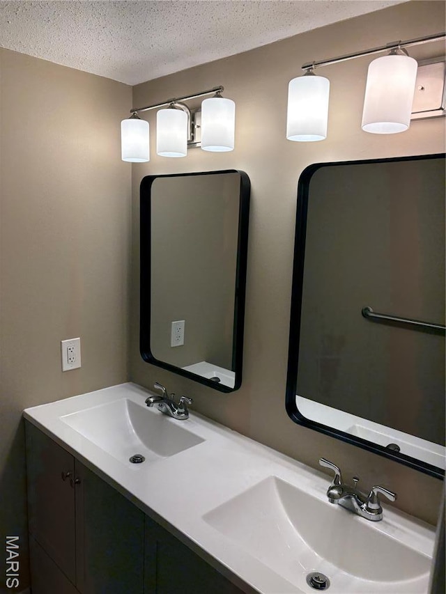 10335 Forest Brook Ln Unit C, Creve Coeur, MO 63146 - full bathroom featuring double vanity and a textured ceiling