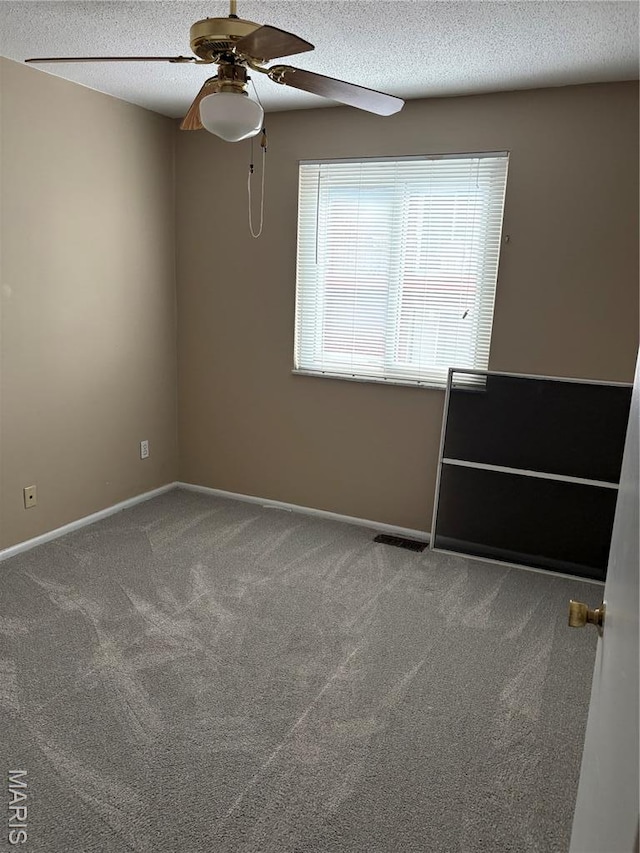 10335 Forest Brook Ln Unit C, Creve Coeur, MO 63146 - spare room featuring a textured ceiling, ceiling fan, and carpet flooring