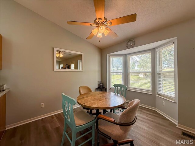 607 Apple Glen Ct, Arnold, MO 63010 - dining room with wood finished floors, a ceiling fan, and lofted ceiling