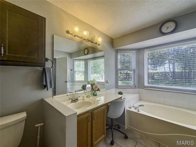 607 Apple Glen Ct, Arnold, MO 63010 - bathroom with a textured ceiling, a bath, vanity, and tile patterned floors