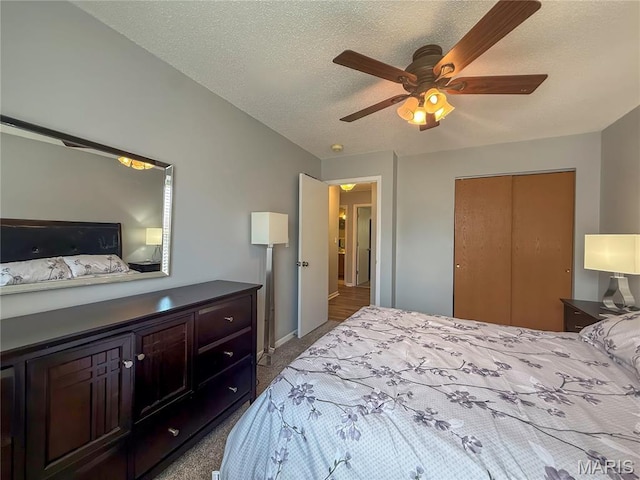 607 Apple Glen Ct, Arnold, MO 63010 - bedroom featuring carpet floors, a textured ceiling, a closet, and a ceiling fan