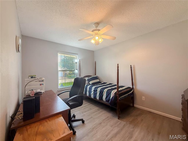 607 Apple Glen Ct, Arnold, MO 63010 - bedroom with wood finished floors, an office area, a textured ceiling, and ceiling fan