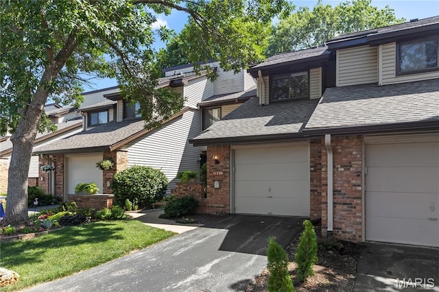 11724 Russet Meadow Dr, Creve Coeur Township, MO 63146 - multi unit property with a shingled roof, brick siding, asphalt driveway, and an attached garage