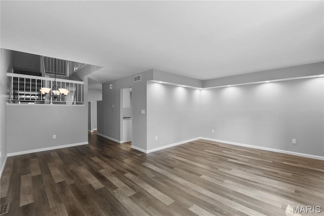 11724 Russet Meadow Dr, Creve Coeur Township, MO 63146 - unfurnished living room with a chandelier and wood finished floors
