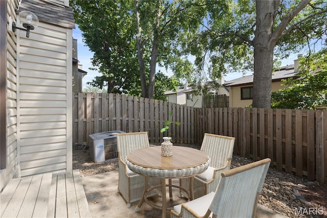 11724 Russet Meadow Dr, Creve Coeur Township, MO 63146 - wooden deck with a fenced backyard, outdoor dining area, and a patio