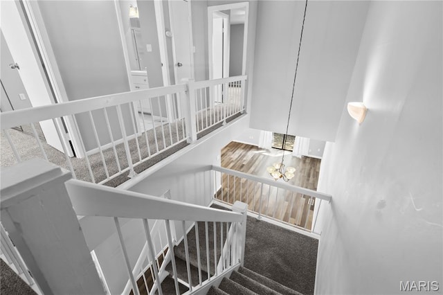 11724 Russet Meadow Dr, Creve Coeur Township, MO 63146 - stairs with a chandelier, a high ceiling, and carpet