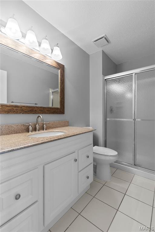 11724 Russet Meadow Dr, Creve Coeur Township, MO 63146 - bathroom featuring vanity, a stall shower, tile patterned floors, and a textured ceiling