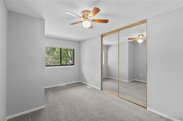 11724 Russet Meadow Dr, Creve Coeur Township, MO 63146 - unfurnished bedroom featuring a textured ceiling, a closet, carpet flooring, and a ceiling fan