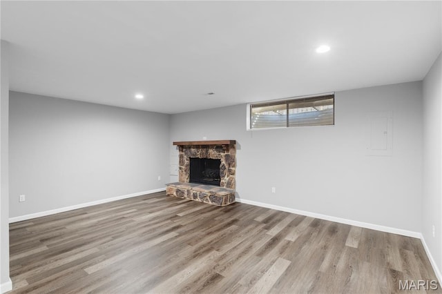 11724 Russet Meadow Dr, Creve Coeur Township, MO 63146 - unfurnished living room with electric panel, wood finished floors, a fireplace, and recessed lighting