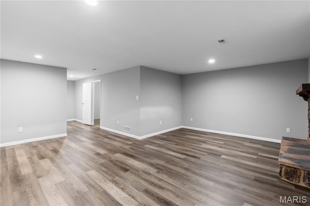 11724 Russet Meadow Dr, Creve Coeur Township, MO 63146 - unfurnished living room with recessed lighting, wood finished floors, and a stone fireplace